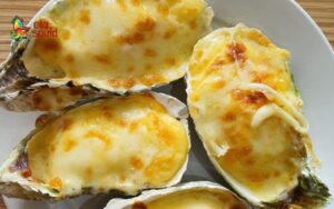 Grilled oysters with cheese